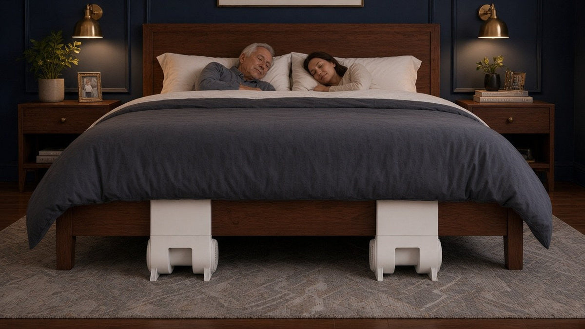 Bed climate control: two people asleep with two bFan bed fans at the foot of the bed, one for each side